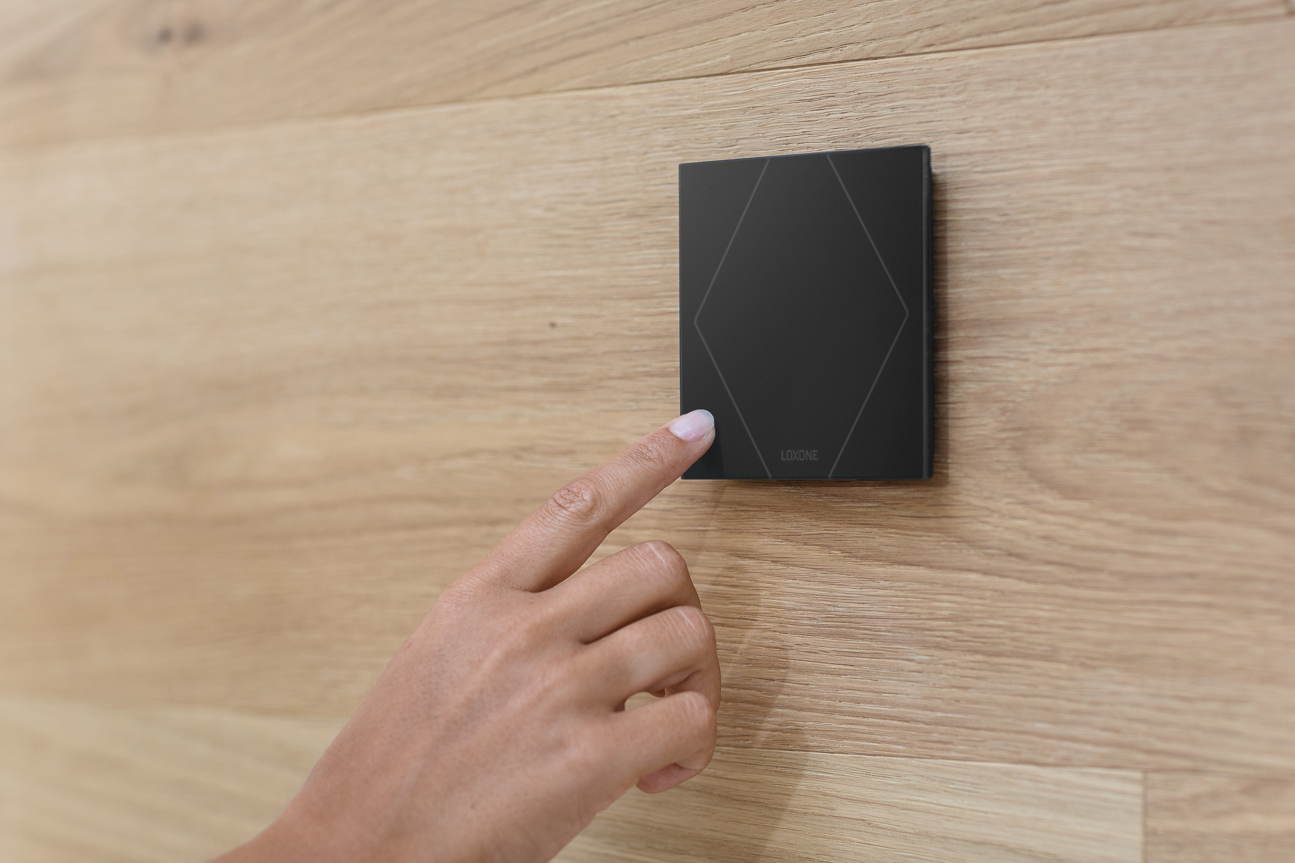 (c)Loxone_Woman-uses-Touch-pure_30